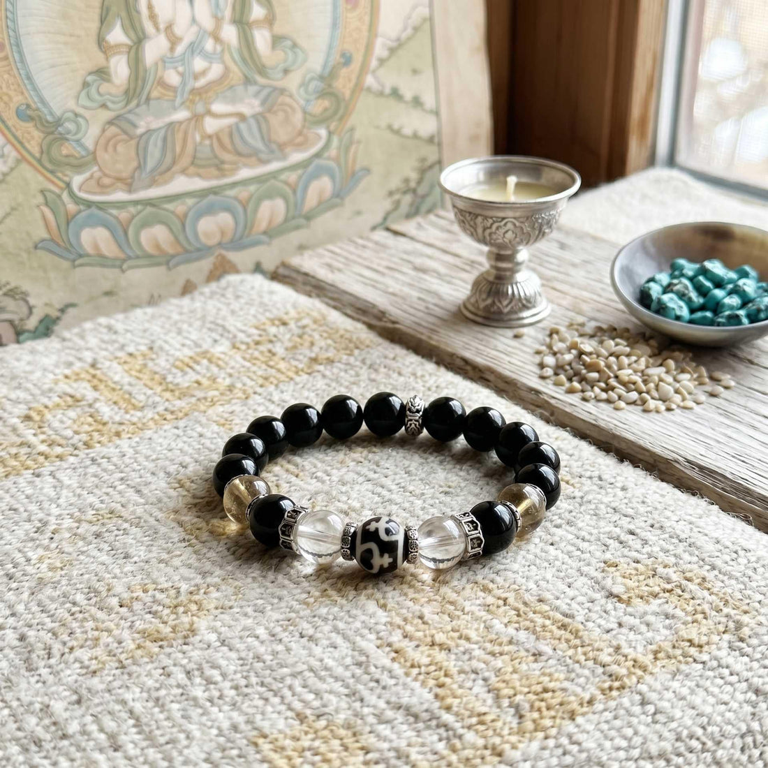 Black obsidian bracelet with Om crystal detail