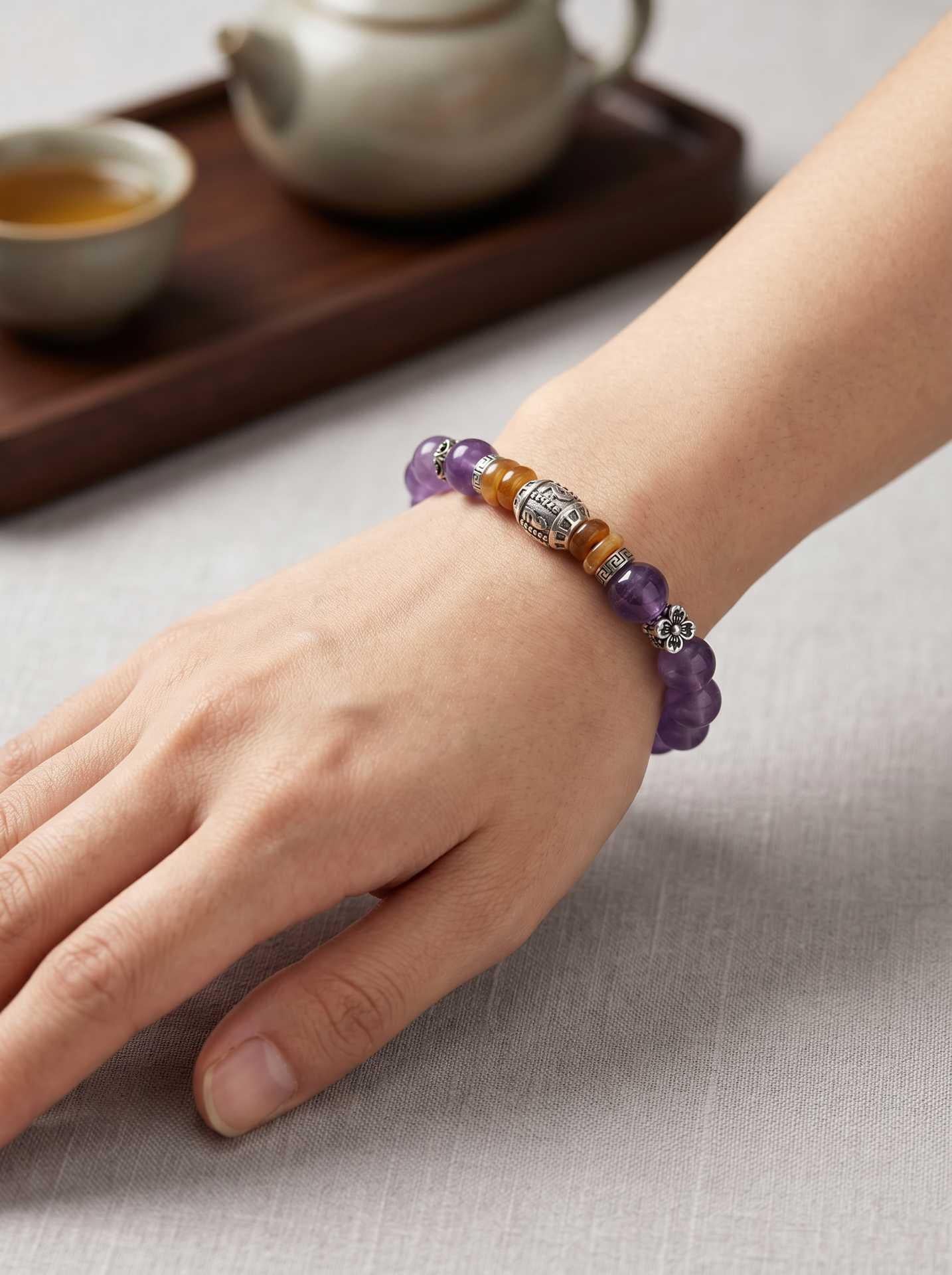 Amethyst Kelsang Mantra Blessing Bracelet — on wrist detail