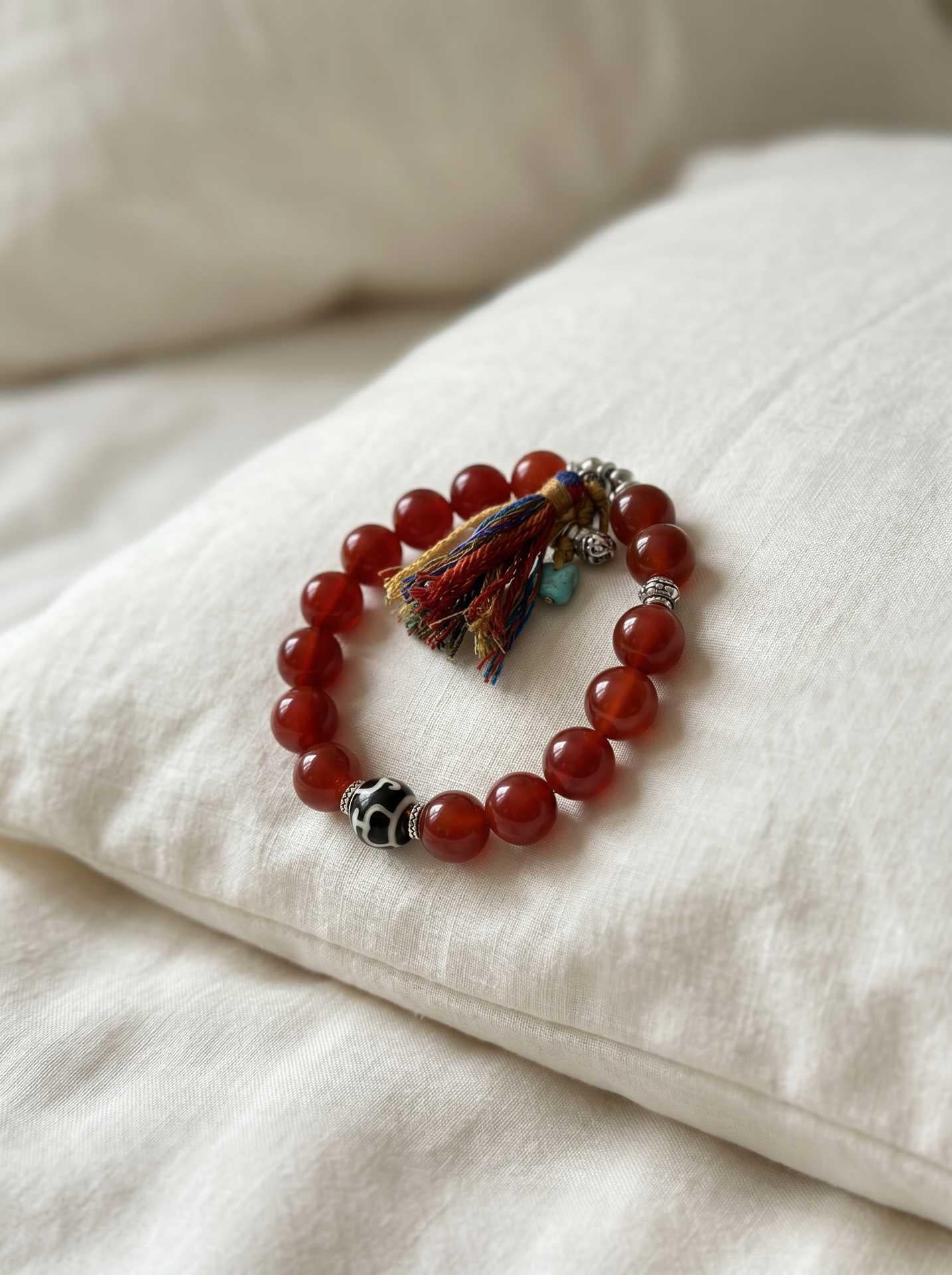 Vessel Dorje Red Agate Bracelet — flat lay on linen